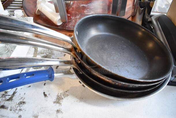 ALL ONE MONEY! Lot of Items on Tabletop Including Metal Bins, Metal Trays, White Poly Trash Can, Tealight Candles, Skillets, Glass Bottles and Glasses - Image 5 of 12