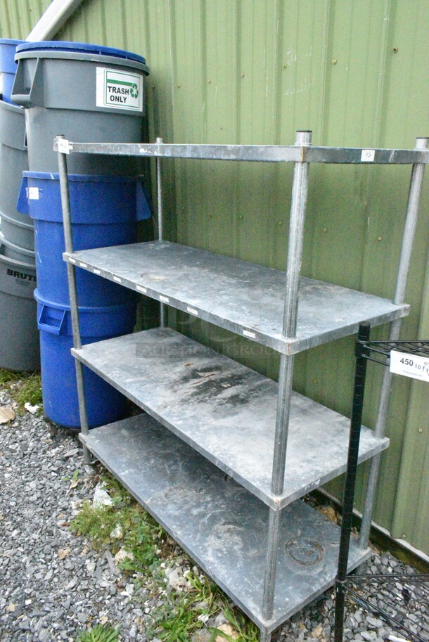 Metal 4 Tier Shelving Unit. BUYER MUST DISMANTLE. PCI CANNOT DISMANTLE FOR SHIPPING. PLEASE CONSIDER FREIGHT CHARGES.
 - Image 1 of 2