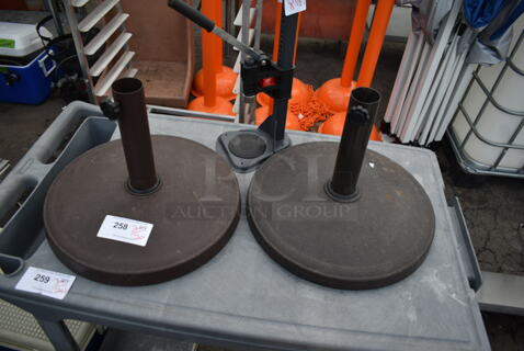 2 Patio Umbrella Bases. 2 Times Your Bid!