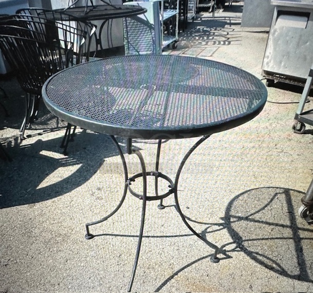One Black Metal Round Patio Table With Umbrella Hole. 28X32