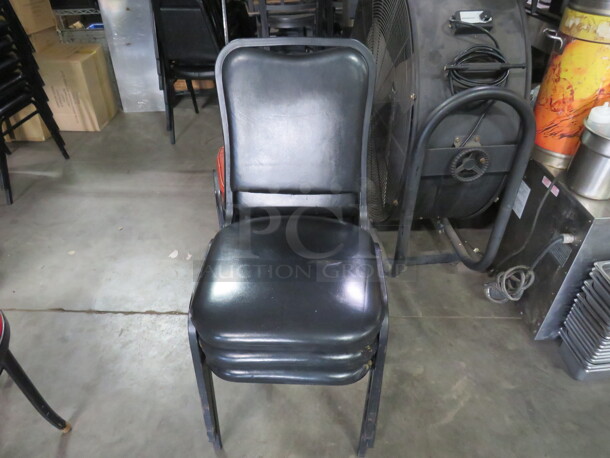Black Metal Stack Chair With Black Cushioned Seat And Back. 4XBID