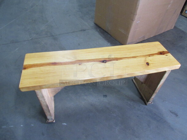 One Solid Wooden Bench In A Natural Finish. 39X11X18