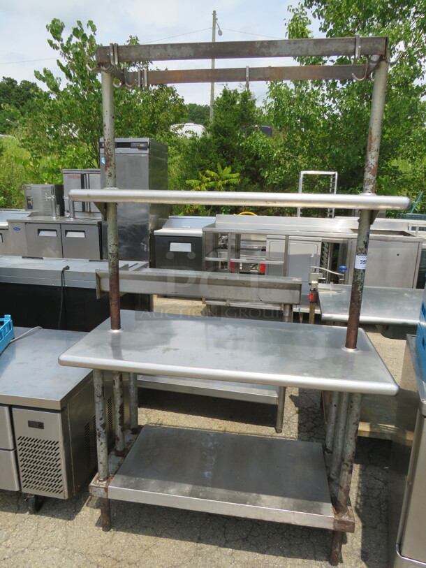 One Stainless Steel Table With 2 Over Shelves, Under Shelf And Pot Rack. 48X24X78 - Image 1 of 2