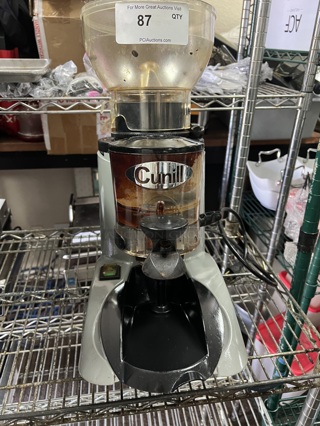 Cunill Coffee Grinder Hopper (1/2kg) made of unbreakable and non-deformable material (co.polyester), with fast lock system and self-levelling when off the coffee grinder, with the possibility of cleaning in a dishwasher at 90 °C. Micrometric regulation of the coffee grind using a regulatory pawl. New expulsion system for the ground coffee (always leaving the grinding cavity clean when the coffee grinder stops). Body made of anti-scratch material, in a single piece (less vibrations, more robustness) with ventilation (internal air inlet and outlet) system. Tray integrated into the bodywork. Adjustment of coffee dosage through an electronic circuit board 0-35’’. Hardened steel grinding blades (62/65HRc) 60mm in diameter. Tested and Working!
