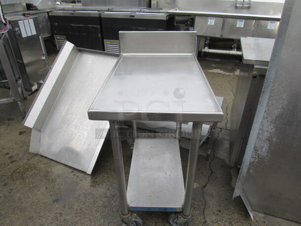 One Stainless Steel Table With Stainless Steel Undershelf, Back Splash, On Casters. 20X32X40