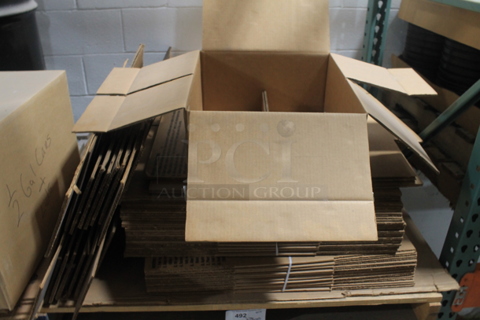 ALL ONE MONEY! TWO PALLET LOT of Various Items Including Carboard Boxes. BUYER MUST REMOVE.