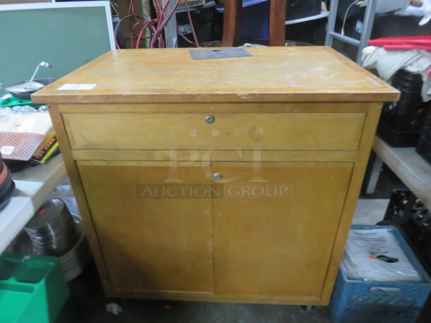 One Wooden 2 Door,1 Drawer Cabinet On Casters. No Key. 40X28X40