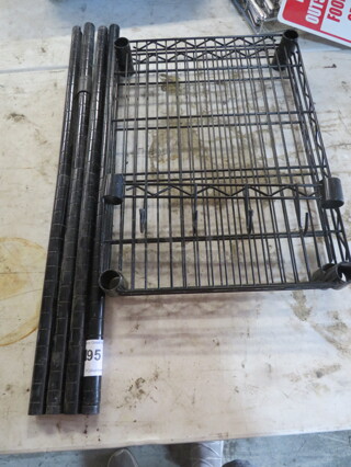 One Black Metro Shelf With 2 Shelves, And A Side Hanger. 21X15X32. Assembly Required.