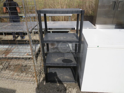 One Poly Shelving System With 4 Shelves. 23X15X49.5