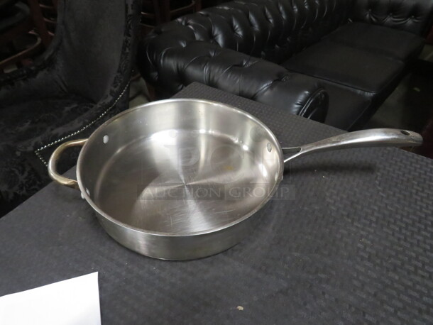 One Stainless Steel Wofgang Puck 11 Inch Sauce Pan.  - Image 1 of 2