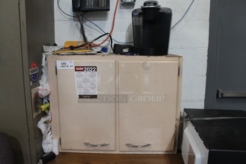 Wooden 2 Door Cabinet w/ Contents Including Keurig.