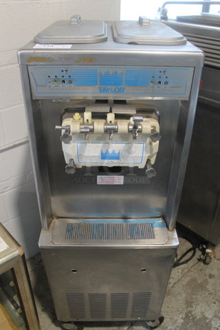 Taylor 794-33 Stainless Steel Commercial Floor Style Air Cooled 2 Flavor w/ Twist Soft Serve Ice Cream Machine on Commercial Casters. 208-230 Volts, 3 Phase.