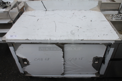 BRAND NEW SCRATCH AND DENT! Stainless Steel Commercial Counter w/ Back Splash, 2 Doors and Under Shelf.