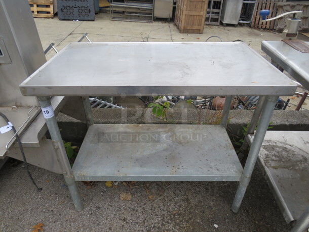 One Stainless Steel Table With Under Shelf. 58X23X33