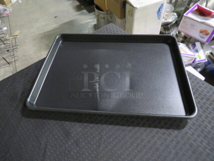 One NEW Vollrath Half Size Coated Sheet Pan. Small Dent.