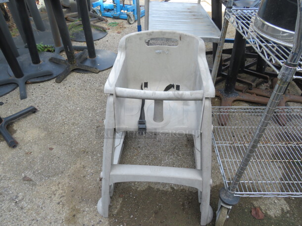 One High Chair With Safety STraps.