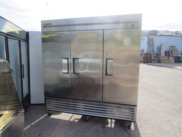 One Stainless Steel 3 Door True Freezer With Racks On Casters. Model# 72F. 115 Volt. Working When Removed.