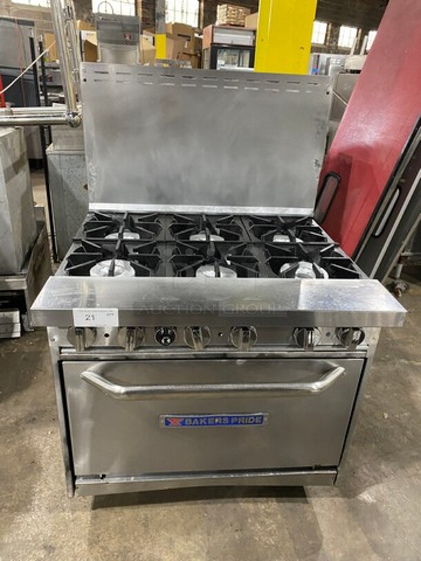 Bakers Pride Commercial Natural Gas Powered 6 Burner Stove! With Raised Back Splash! With Oven Underneath! All Stainless Steel! On Legs! Model: 36BP6BS30N SN: 9910518050013 - Image 1 of 10