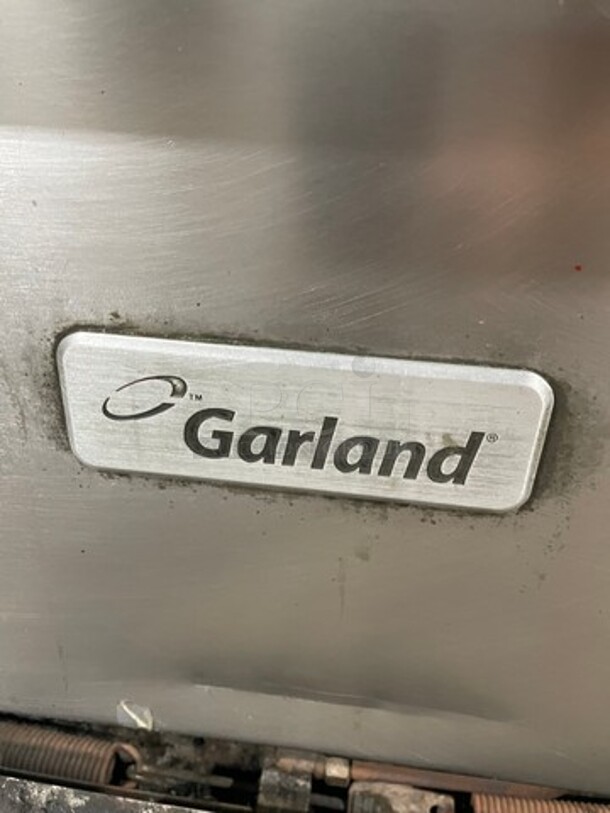 Garland Natural Gas Powered 10 Burner Stove! With Double Full Size Oven Underneath! With Raised Back Splash & Salamander Shelf! Working When Removed!  - Image 7 of 9