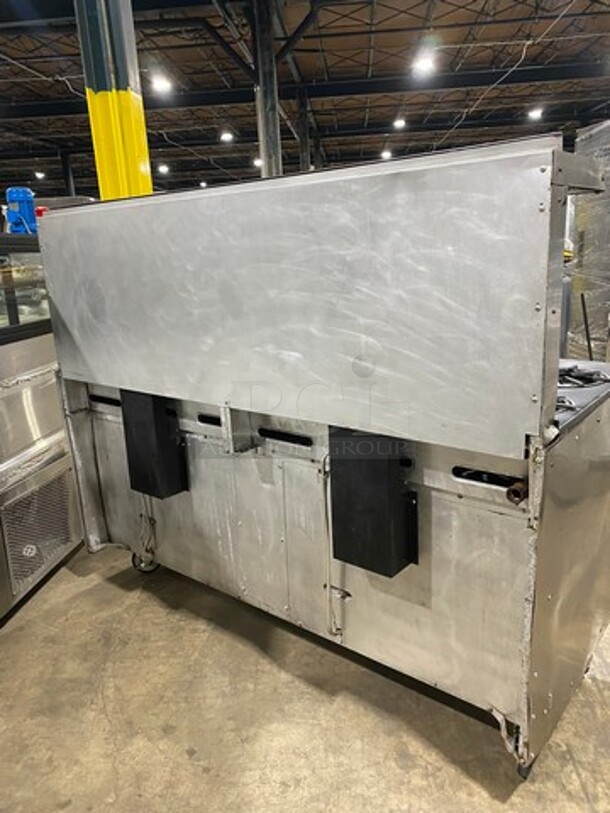 AMAZING FIND! Garland Natural Gas Powered 12 Burner Stove! With 2 Full-Sized Ovens! With Metal Oven Racks! With Raised Back Splash & Salamander Shelf! Stainless Steel! On Casters! WORKING WHEN REMOVED! - Image 4 of 11