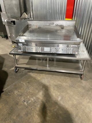 Garland Commercial Countertop Gas Powered Flat Griddle! With Back And Side Splashes! On Equipment Stand! With Storage Space Underneath! All Stainless Steel! On Casters!