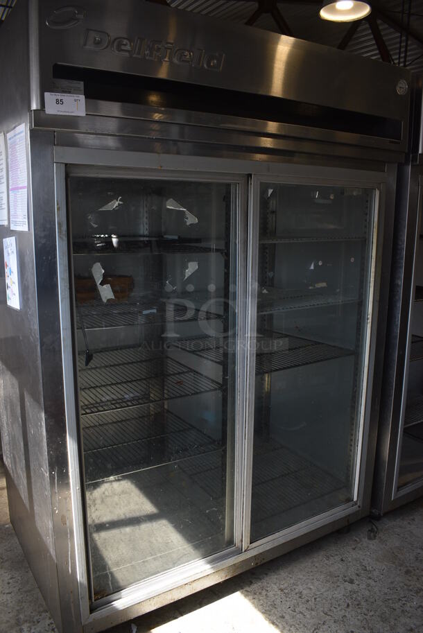 Delfield Model MRR2-SL Stainless Steel Commercial 2 Door Reach In Cooler Merchandiser w/ Metal Racks on Commercial Casters. 115 Volts, 1 Phase. 56x34x79. Tested and Working!