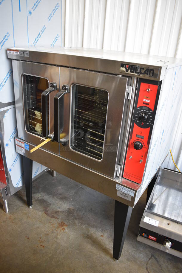 BRAND NEW SCRATCH AND DENT! Vulcan Model VC5GD-11D1Z Stainless Steel Commercial Natural Gas Powered Full Size Convection Oven w/ View Through Doors, Metal Oven Racks and Thermostatic Controls on Metal Legs. 40x31x55