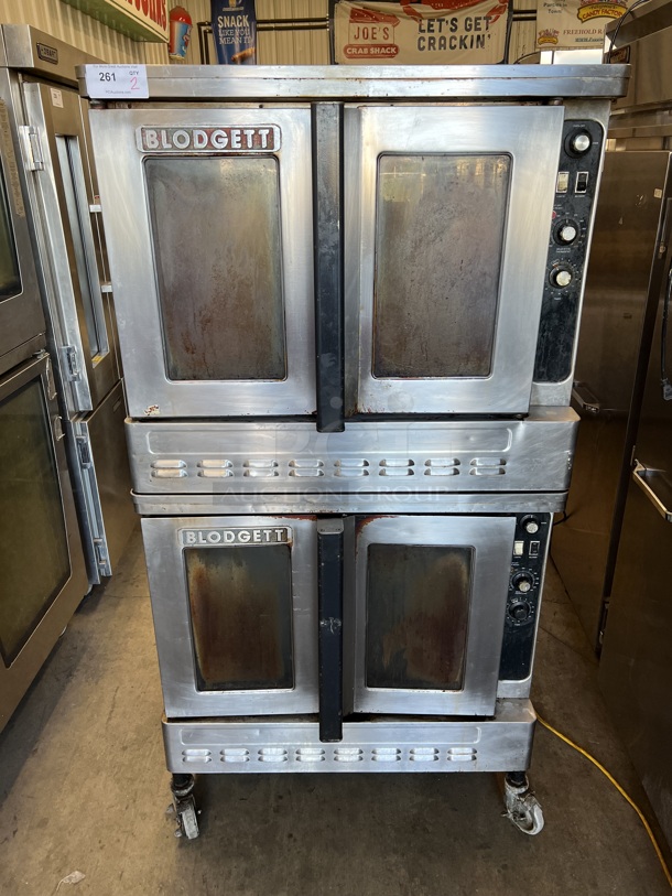 2 Blodgett Stainless Steel Commercial Natural Gas Powered Full Size Convection Ovens w/ View Through Doors, Metal Oven Racks and Thermostatic Controls on Commercial Casters. 38x40x73. 2 Times Your Bid!
