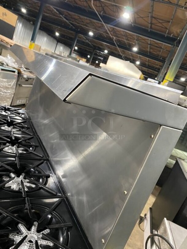 AMAZING FIND! Garland Natural Gas Powered 10 Burner Stove! With 2 Full-Sized Ovens! With Metal Oven Racks! With Raised Back Splash & Salamander Shelf! Stainless Steel! On Casters! - Image 10 of 11