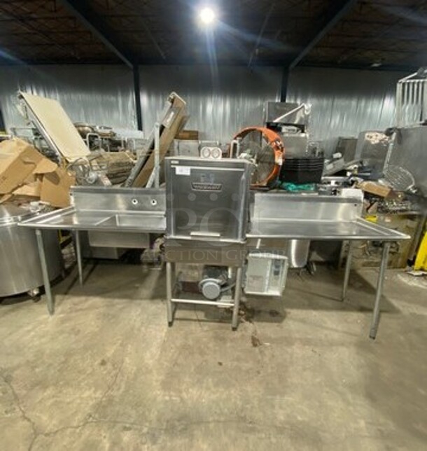 WOW! Hobart Commercial Pass-Through Dishwasher! All Stainless Steel! On Legs! With Left And Right Side Dish Washing Table! With Back Splash! On Legs! Model: AM12 SN: 12045138 200/240V 60HZ 1 Phase! Measurements Are With Tables In Place!  - Image 1 of 11