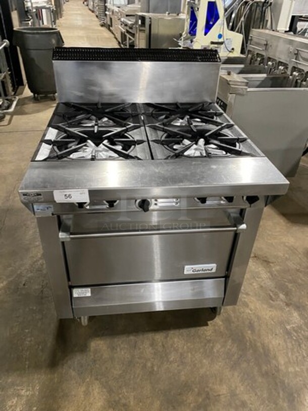 Garland Commercial Natural Gas Powered 4 Burner Stove! With Back Splash! With Oven Underneath! Metal Oven Rack! All Stainless Steel! On Casters! Model: M44R SN: 1601100100589 - Image 1 of 10