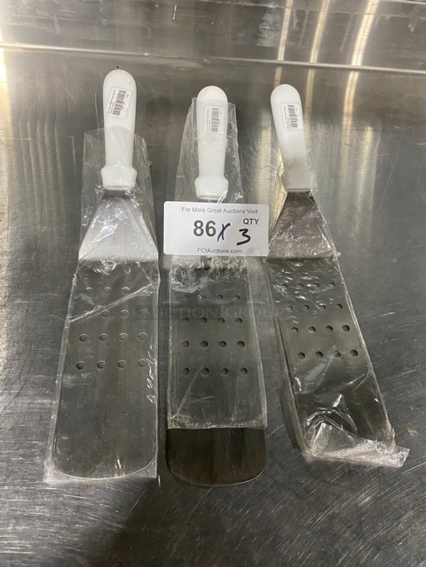 NEW! Stainless Steel Perforated Spatulas! With White Plastic Handle! 3x Your Bid! - Image 1 of 5