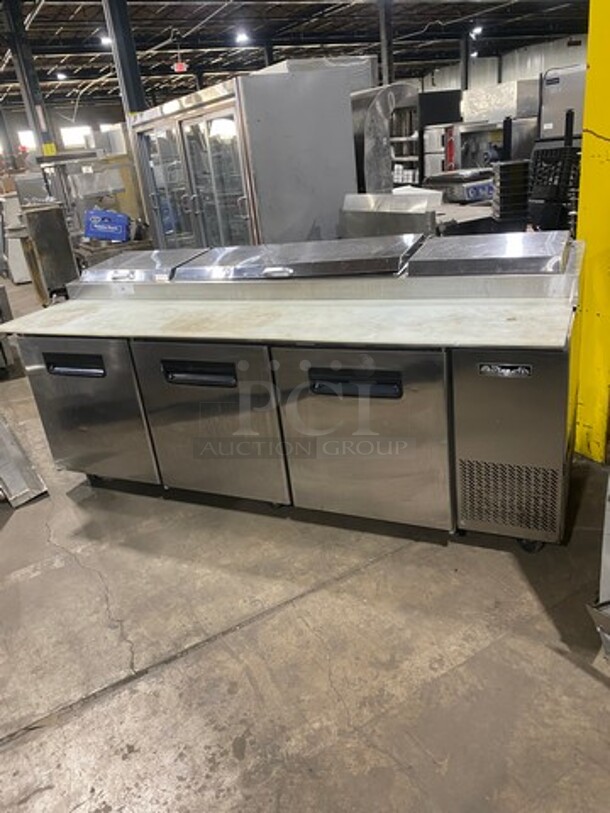 Blue Air Commercial Refrigerated Pizza Prep Table! With Commercial Cutting Board! With 3 Door Storage Space Underneath! Poly Coated Racks! All Stainless Steel! Model: BAPP93 SN: EUUBAPP930009 115V 60HZ 1 Phase
