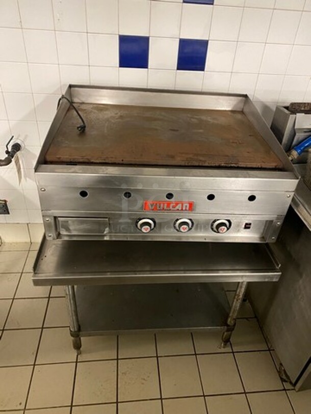 Vulcan Commercial Countertop Flat Top Griddle! With Back And Side Splashes! On Equipment Stand! With Storage Space Underneath! All Stainless Steel! On Legs!