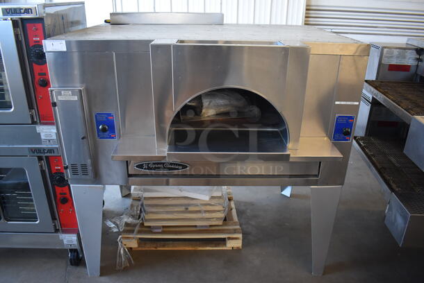 BRAND NEW! 2019 Bakers Pride FC-516 Stainless Steel Commercial Natural Gas Powered / Coal Burning / Wood Fired Il Forno Pizza Oven w/ Cooking Stones on Metal Legs. 140,000 BTU. 65.5x54x67