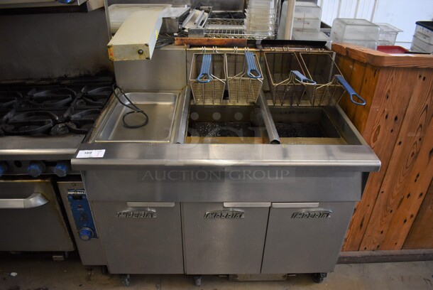 Imperial IFSCB250T Stainless Steel Commercial Natural Gas Powered 2 Bay Deep Fat Fryer w/ Left Side Dumping Station and 4 Metal Fry Baskets on Commercial Casters. 280,000 BTU. 46.5x33.5x51.5