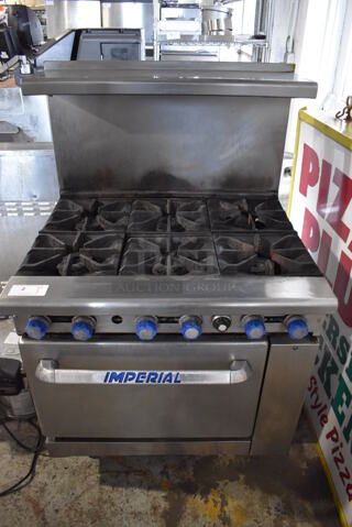 Imperial Stainless Steel Commercial Natural Gas Powered 6 Burner Range w/ Convection Oven, Over Shelf and Back Splash on Commercial Casters. 36x33x57