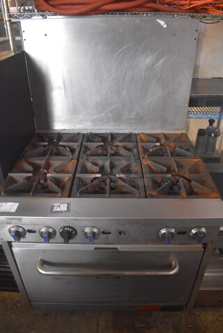 Patriot FMGR-36/NG Stainless Steel Commercial Natural Gas Powered 6 Burner Range w/ Oven and Back Splash on Commercial Casters. 196,000 BTU. 36x33x60