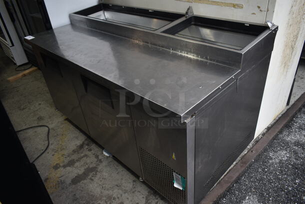2017 True TPP-67 Stainless Steel Commercial Pizza Prep Table on Commercial Casters. No Lids. 115 Volts, 1 Phase. 115 Volts, 1 Phase. Tested and Does Not Power On