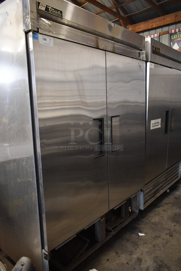 2012 True T-49 ENERGY STAR Stainless Steel Commercial 2 Door Reach In Cooler w/ Poly Coated Racks on Commercial Casters. 115 Volts, 1 Phase. Tested and Does Not Power On