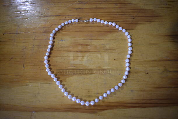 Authentic Pearl Necklace w/ 14 Karat Gold Clasp.