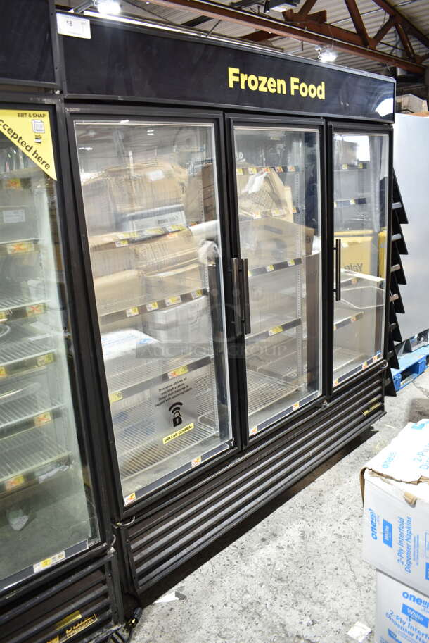 2015 True GDM-72F-LD ENERGY STAR Metal Commercial 3 Door Reach In Freezer Merchandiser w/ Poly Coated Racks on Commercial Casters. 115/208-240 Volts, 1 Phase. Tested and Working! - Image 1 of 7