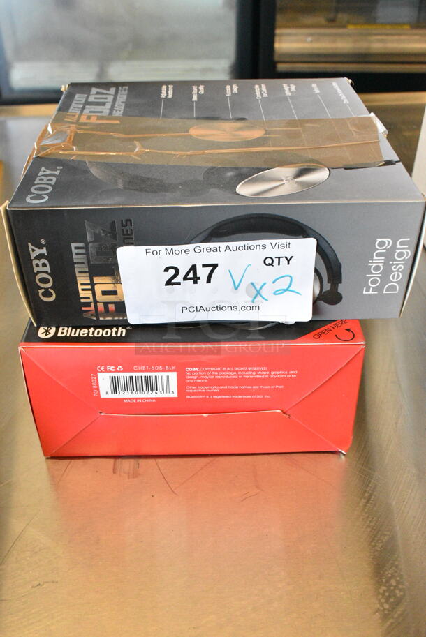 2 Items Including Coby Aluminum Foldz Headphones and Coby Stereo Bluetooth Headphones. 2 Times Your Bid!  - Image 1 of 5