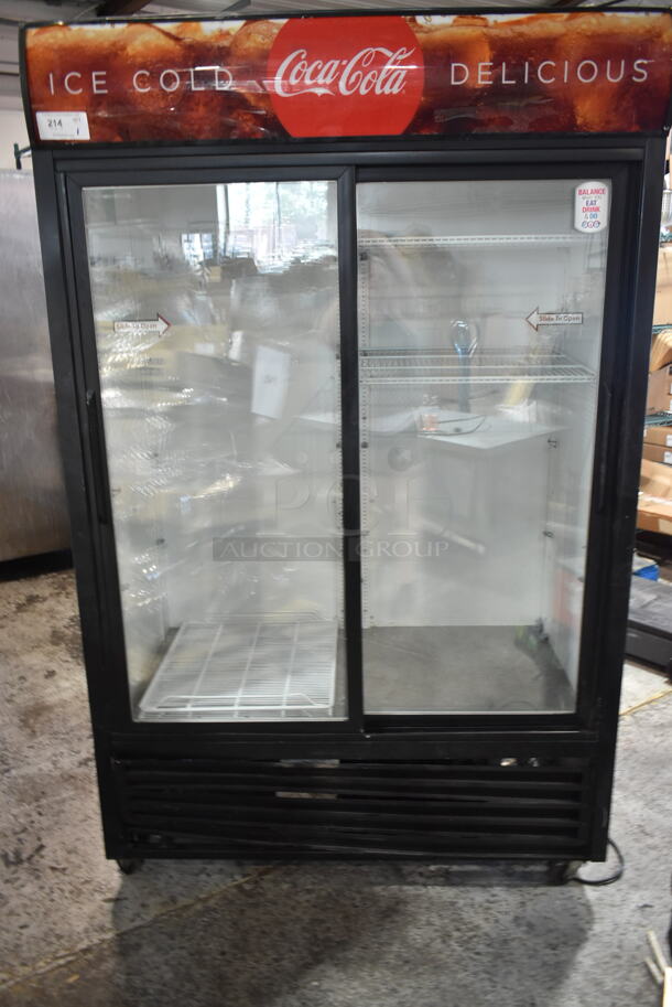 True GDM-45 Metal Commercial 2 Door Reach In Cooler Merchandiser w/ Poly Coated Racks on Commercial Casters. 115 Volts, 1 Phase. Tested and Powers On But Does Not Get Cold