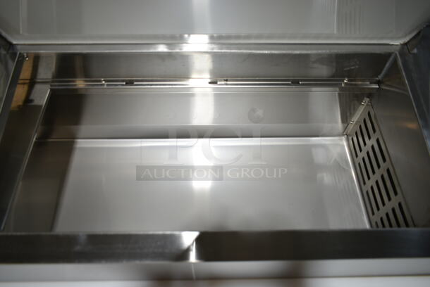 BRAND NEW SCRATCH AND DENT! 2024 Avantco 178SSPPT2 Stainless Steel Commercial Prep Table w/ Over Sized Cutting Board and 2 Drawers. Missing Door. 115 Volts, 1 Phase. Tested and Powers On But Does Not Get Cold  - Image 4 of 8
