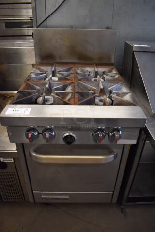 Southbend S24E Stainless Steel Commercial Natural Gas Powered 4 Burner Range w/ Oven and Back Splash on Commercial Casters. 24.5x34x47
