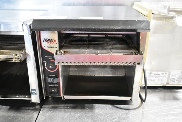 APW Wyott AT EXPRESS Stainless Steel Commercial Countertop Conveyor Toaster Oven. 120 Volts, 1 Phase.  - Image 1 of 6