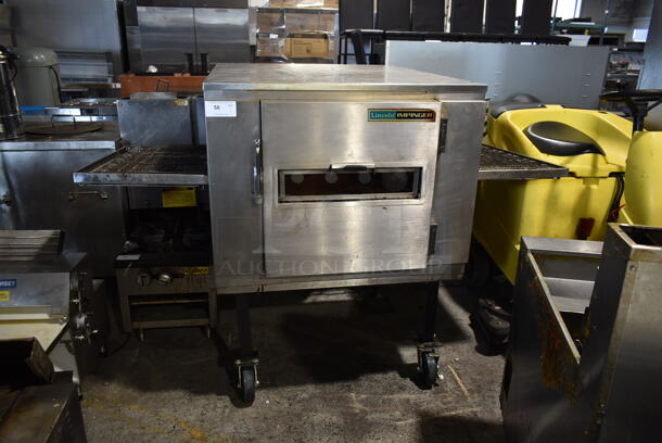 Lincoln Impinger Stainless Steel Commercial Natural Gas Powered Single Deck Conveyor Pizza Oven on Commercial Casters. 