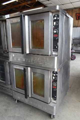 2 Blodgett Stainless Steel Commercial Natural Gas Powered Full Size Convection Oven w/ View Through Doors, Metal Oven Racks and Thermostatic Controls on Commercial Casters. 2 Times Your Bid!