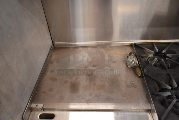 Migali C-RO4-24GL-NG Stainless Steel Commercial Natural Gas Powered 4 Burner Range w/ Flat Top Griddle, 2 Ovens, Over Shelf and Back Splash on Commercial Casters.  - Image 3 of 12